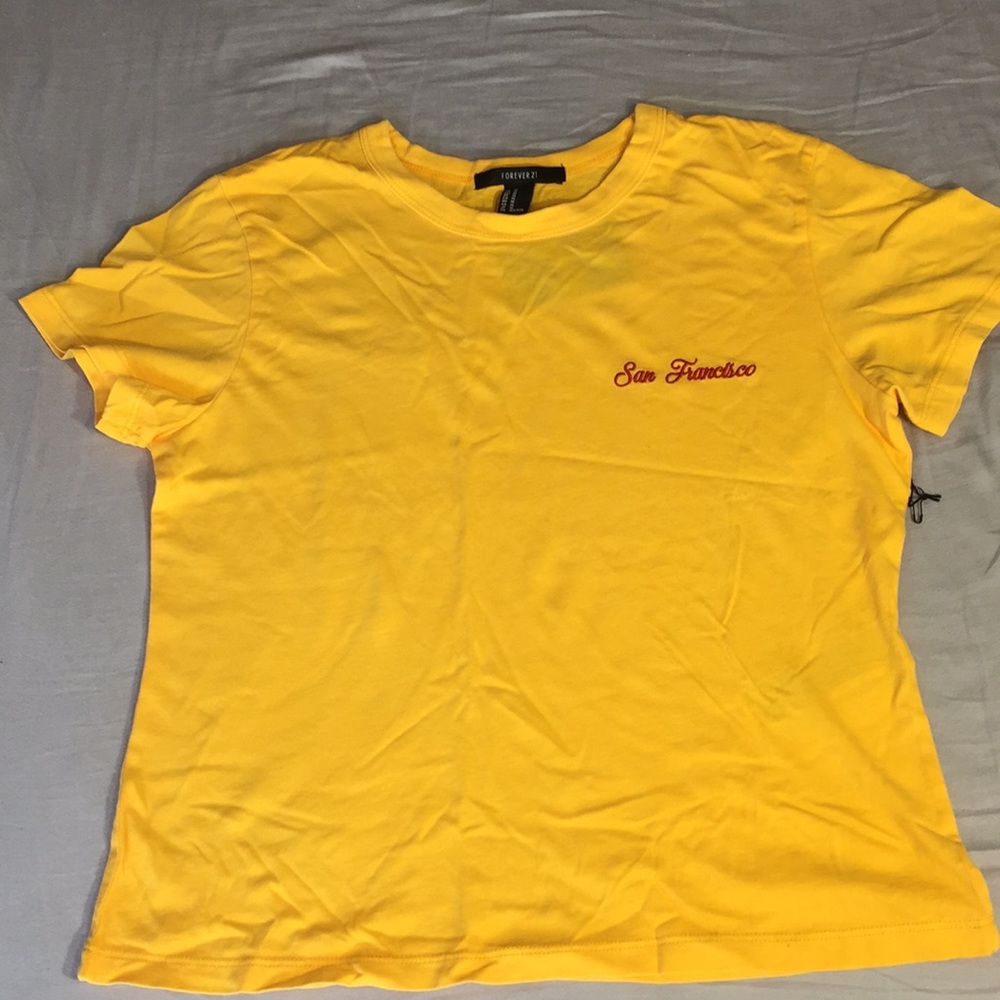 I’m selling a mustard yellow t-shirt